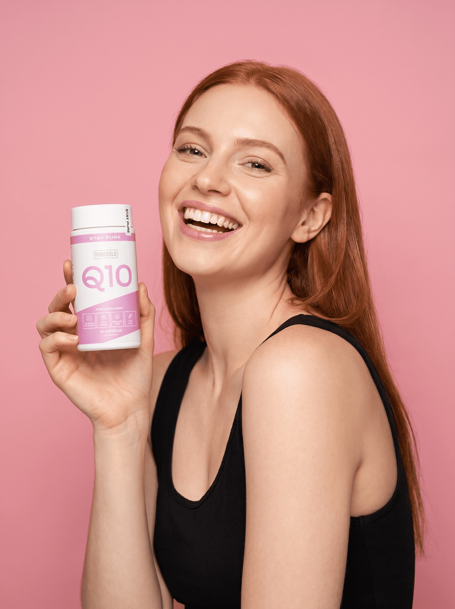 Woman holding Pure Gold Q10